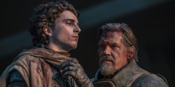 Josh Brolin as Gurney Halleck looking intensely at Timothee Chalamet as Paul Atreides in Dune Part 2