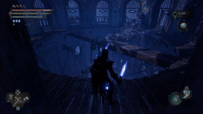 Player standing at the roof building, near a wooden bridge Lords of the Fallen