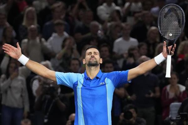 Serbia's Novak Djokovic celebrates after winning the quarterfinal match against Denmark's Holger Rune.