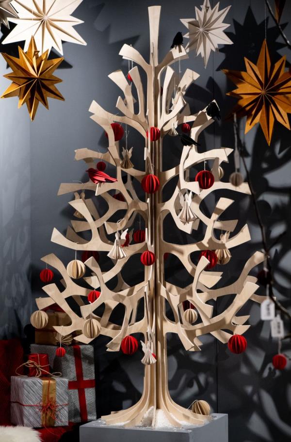 This wooden Christmas tree will last more than one season. The decorations are also wooden. 