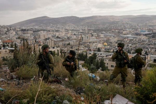 Israeli soldiers are seen during a military operation in the Balata refugee camp, West Bank, Sunday, Nov. 19, 2023. (AP Photo/Majdi Mohammed)